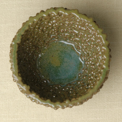 Ceramic decorative bowl designed for modern home decor. The top shot photo shows inside of the bowl. #color_olive green