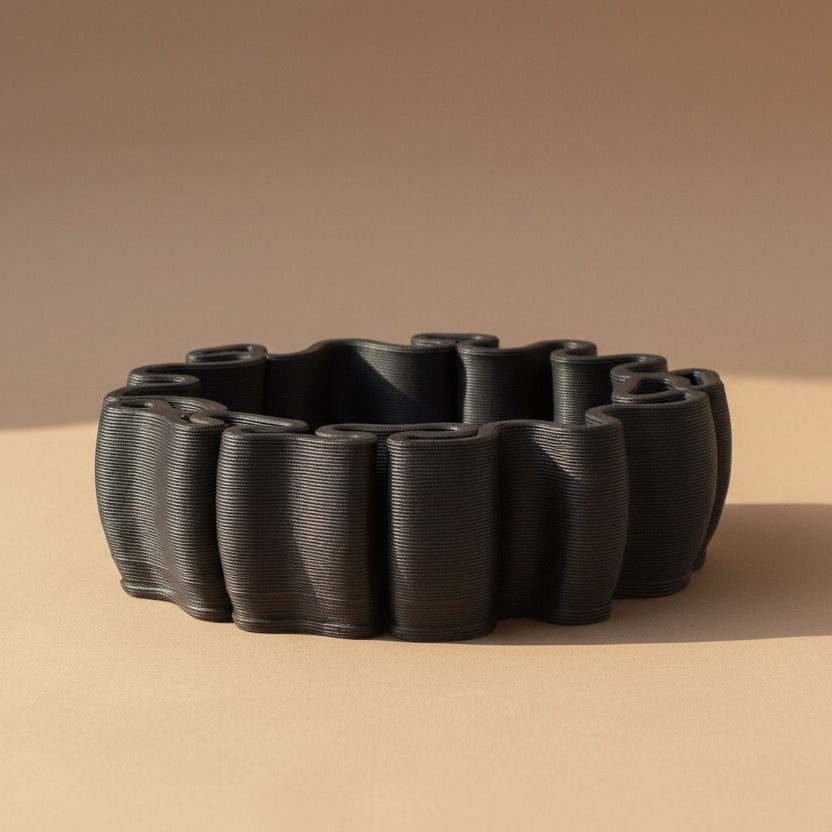 A dark charcoal gray ceramic bonsai planter, ceramic tray or decorative pot.