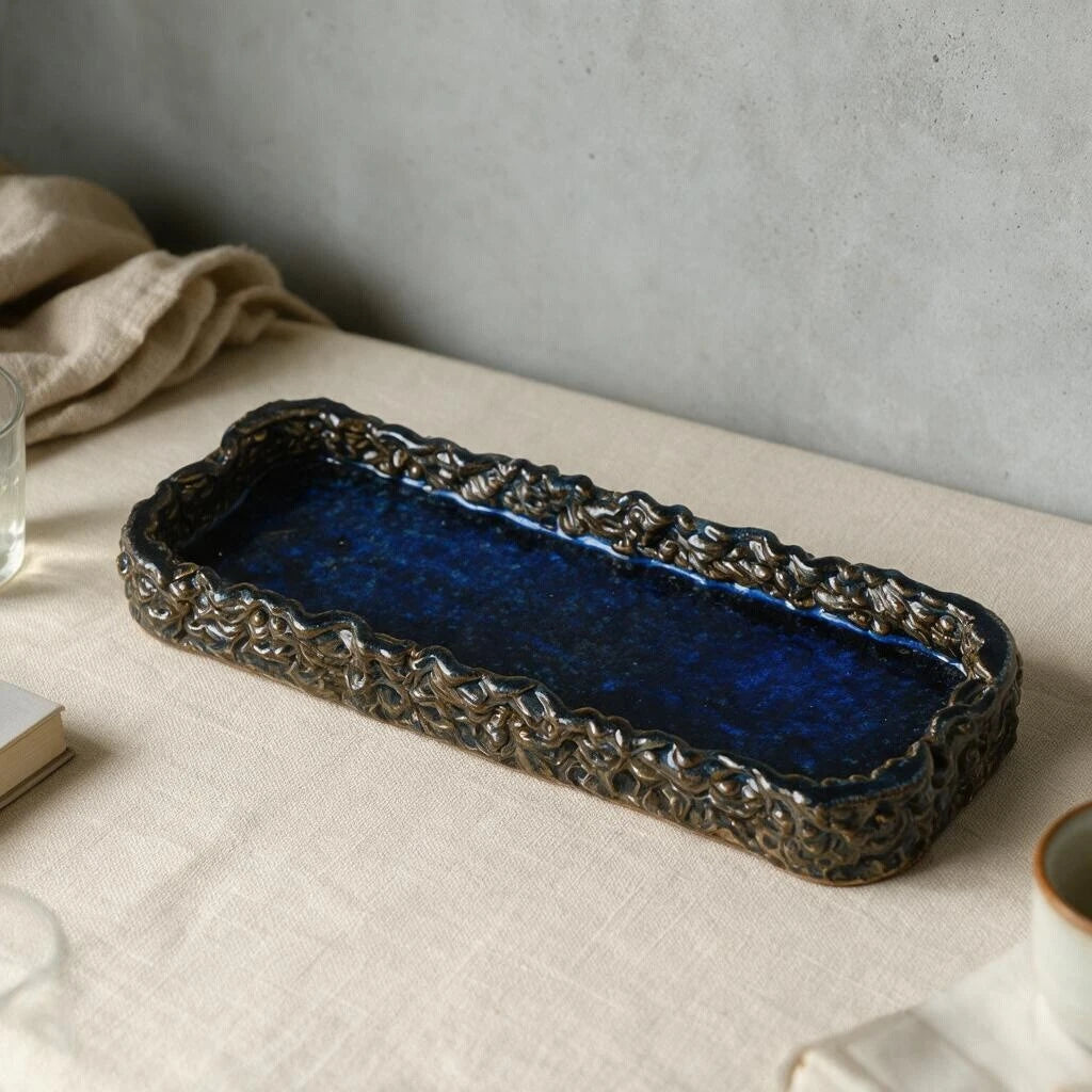 Glossy midnight blue 3D printed ceramic catchall tray featuring textured woven rim and smooth deep blue interior basin #color_sapphire blue