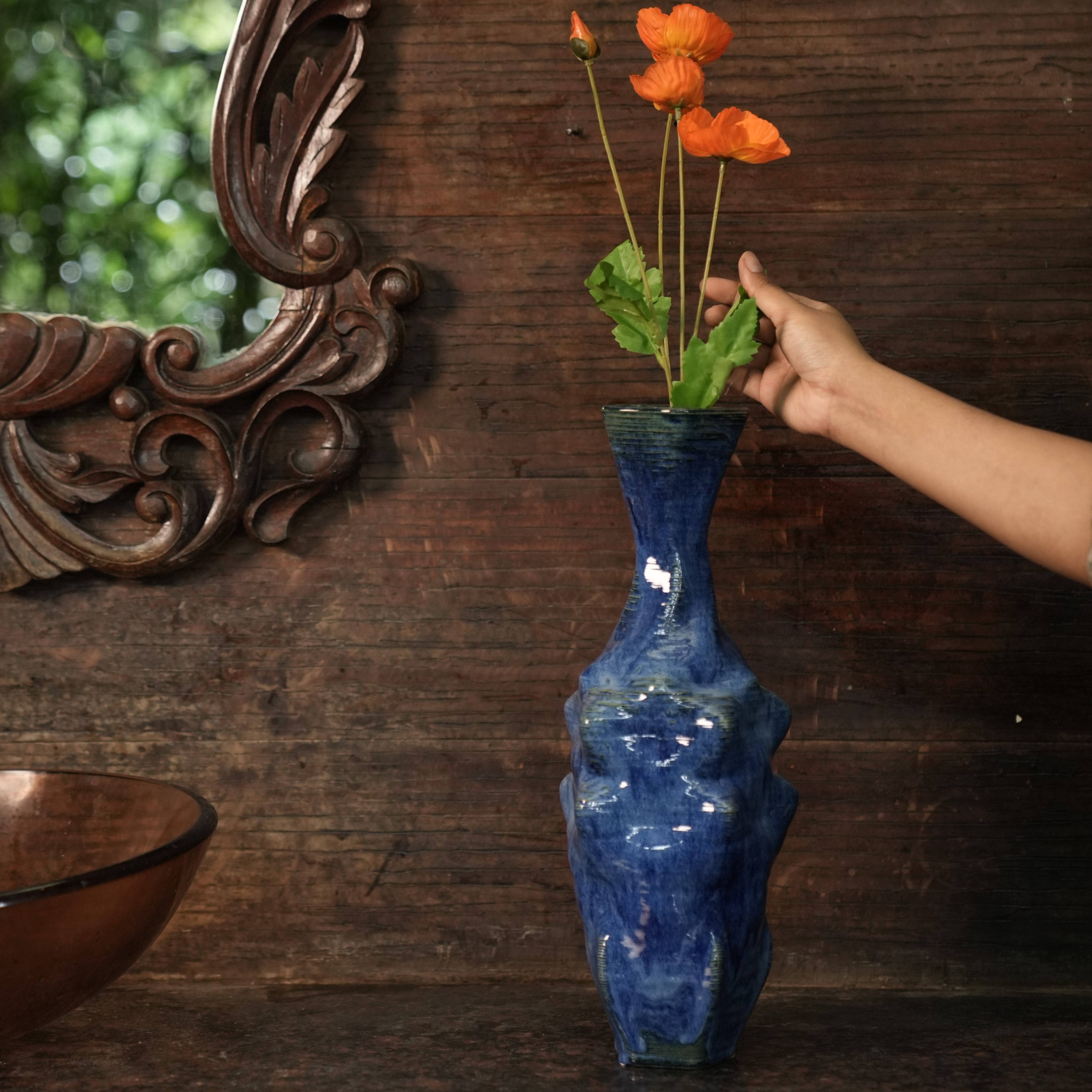 Blue ceramic vase with orange flowers #color_sapphire blue