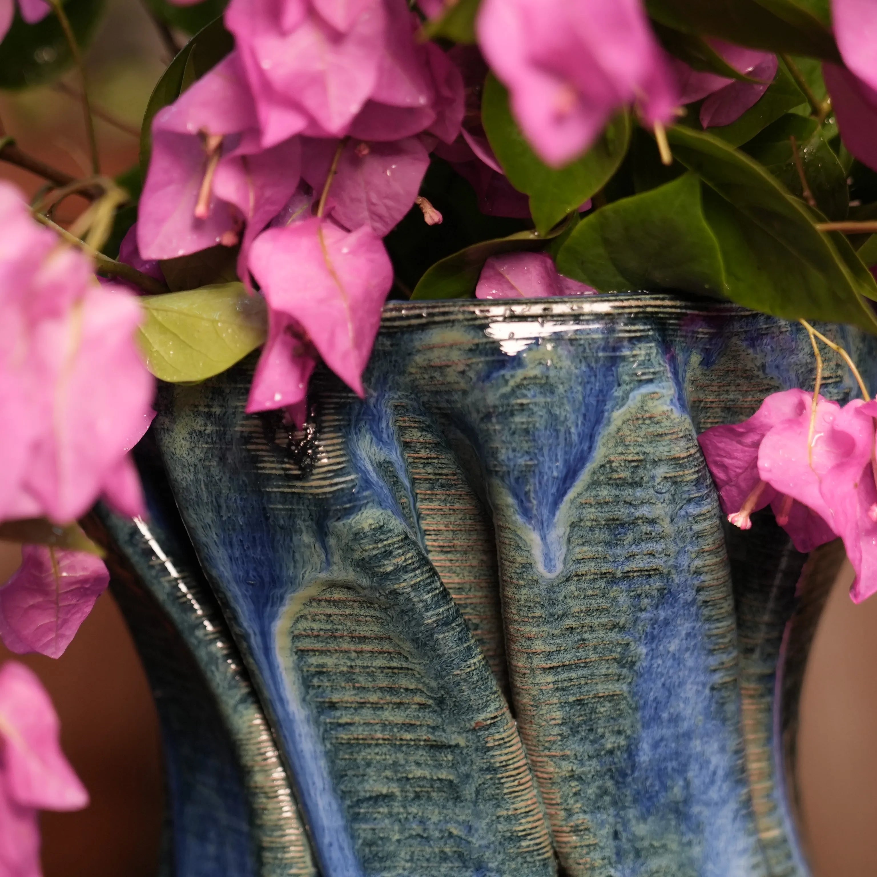 Ceramic blue tall vase with flowers close up view #color_sapphire blue
