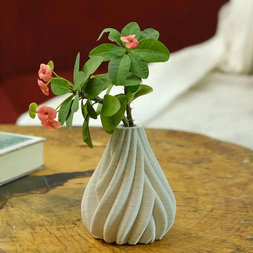 White ceramic small vase with flowers on coffee table #color_white