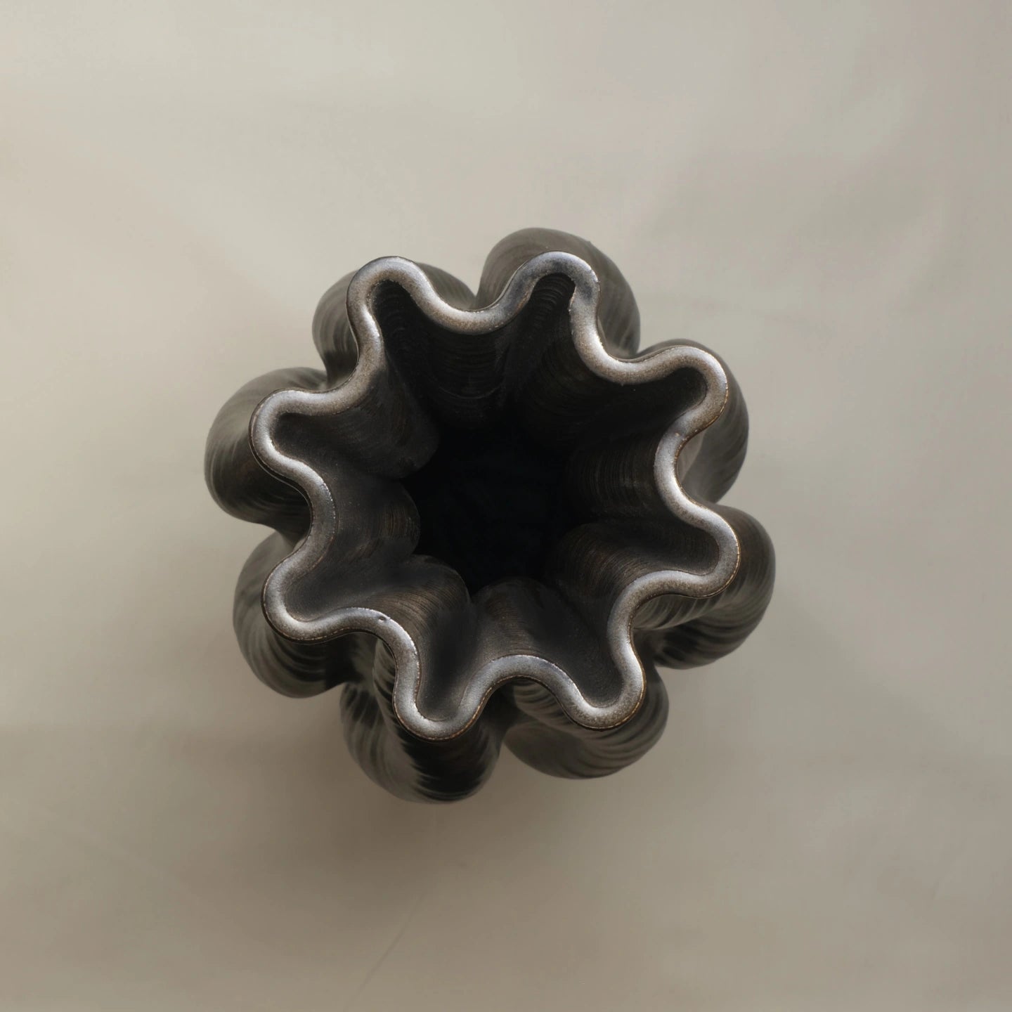 Designer black Ceramic Table Vase 3D printed top view #color_black