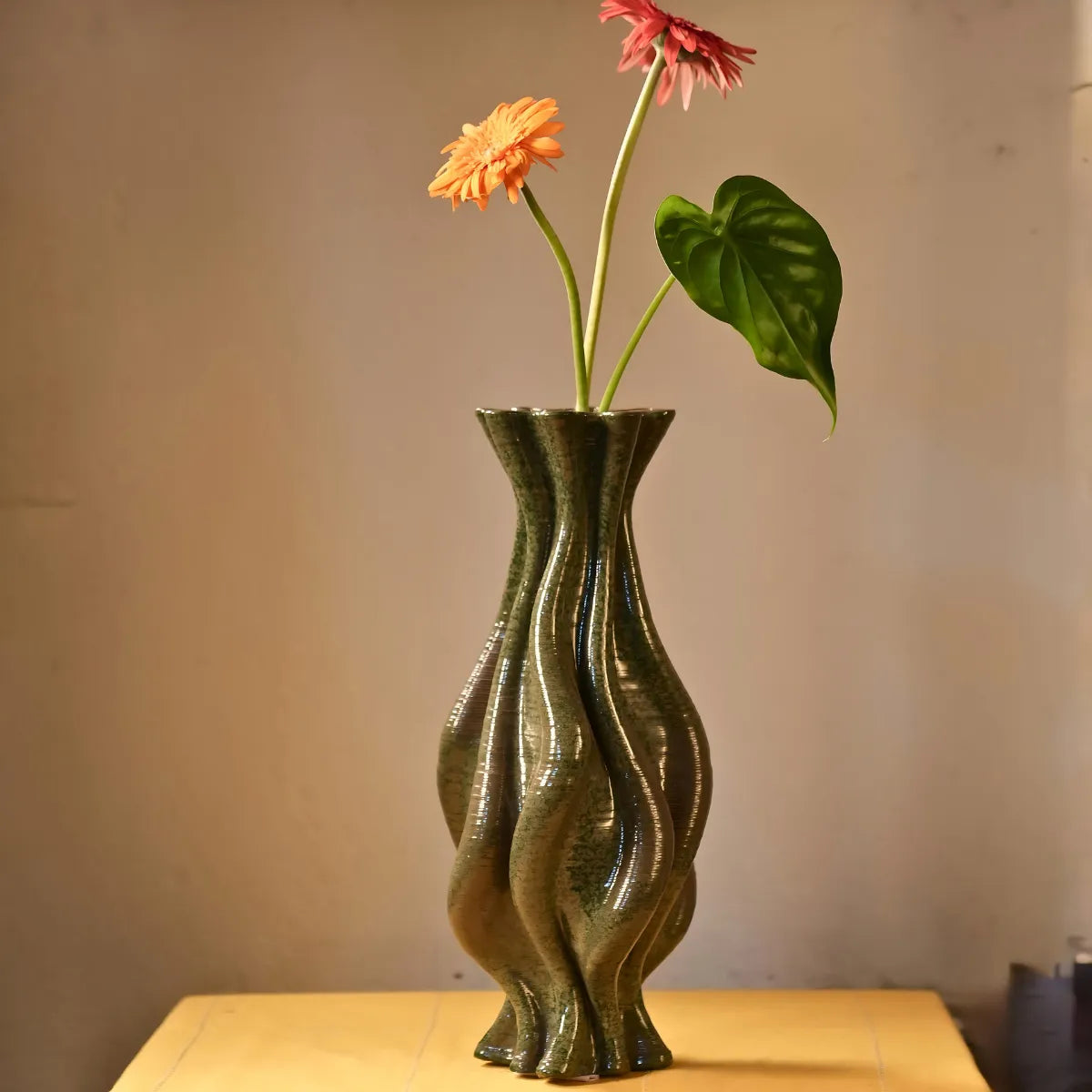 Green ceramic vase with flowers #color_olive green