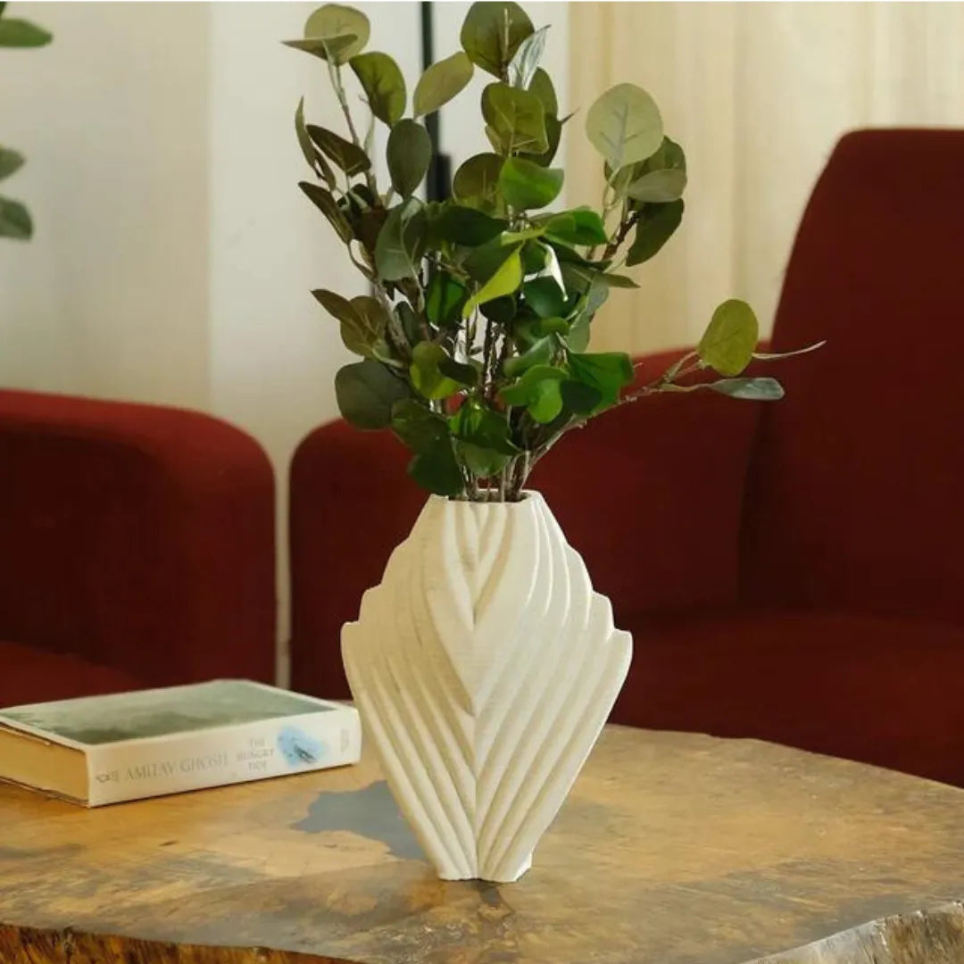 Unique white ceramic vase styled with flowers in a living room #color_white